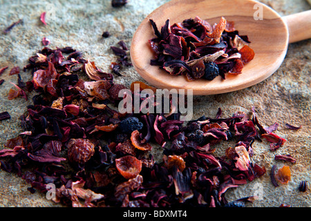 Fruit tea with a wooden spoon on a stone slab Stock Photo