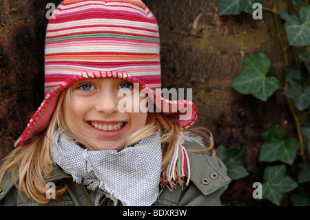 Six-year-old girl wearing a woollen hat in winter, portrait Stock Photo