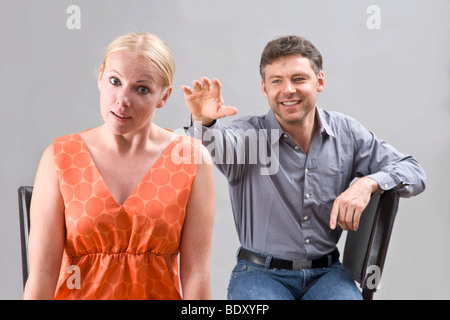 Young man stretching his arm out to his girlfriend Stock Photo