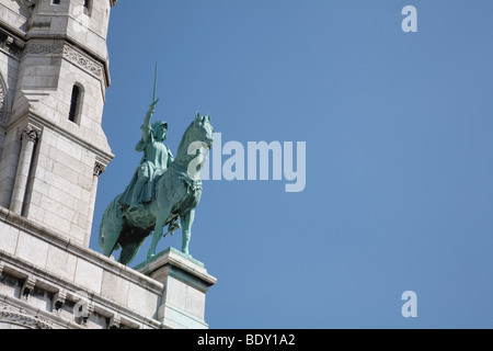 Statue of Joan of Arc (Jeanne d'Arc) on the Facade of Sacre Coeur, Paris, France Stock Photo