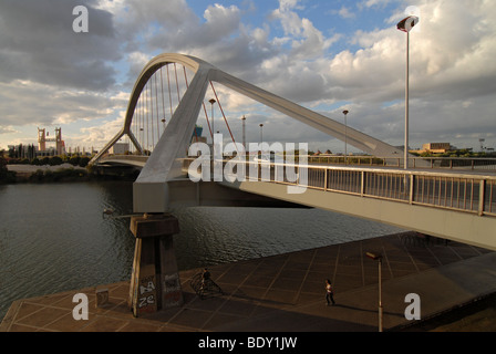 Clouds above Barqueta bridge, Puente de la Barqueta, over Guadalquivir River, constructed to provide access to the Expo 92, Sev Stock Photo