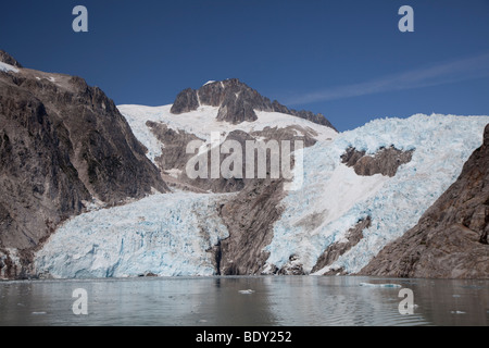 Seward, Alaska - Northwestern Glacier spills into Northwestern Fjord in Kenai Fjords National Park. Stock Photo