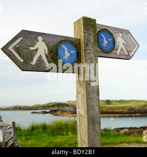 Signpost for the Isle of Anglesey Coastal Path, Cemaes Bay, Ynys Mon, North Wales, UK Stock Photo