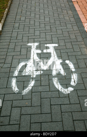 photograph of bicycle image painted on cycle way Stock Photo