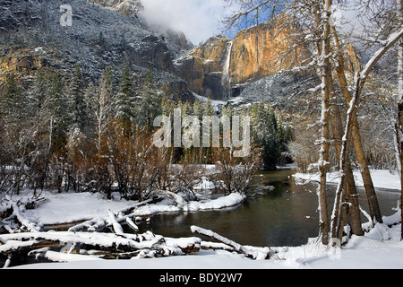 The Merced River winds it way past Yosemite Falls after a clearing winter storm. Yosemite National Park, California, USA. Stock Photo