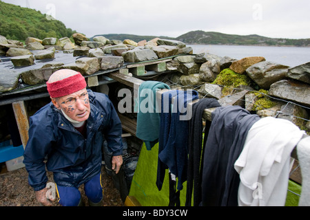 Tom Leppard the 'Leopard Man of Skye' is a hermit and the world's most tattooed man, with tattoos covering over 99% of his body. Stock Photo