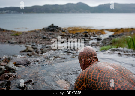 Tom Leppard the 'Leopard Man of Skye' is a hermit and the world's most tattooed man, with tattoos covering over 99% of his body. Stock Photo