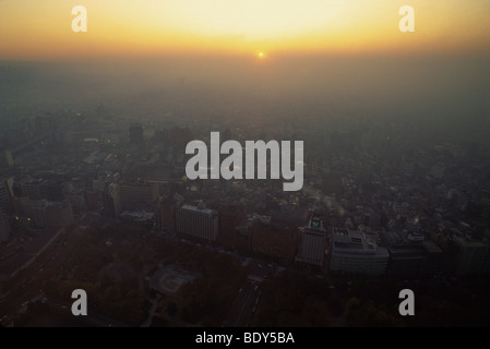 Aerial view of smog at sunset over west Shinjuku district, Tokyo, Japan Stock Photo