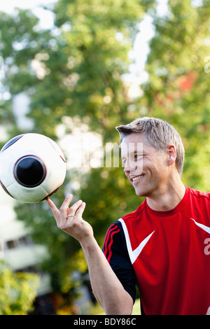 Soccer Player Balancing Ball Stock Photo