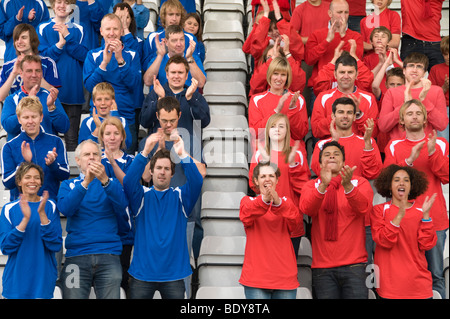 Rival fans at football match Stock Photo