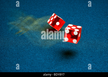 Rolling dice Stock Photo