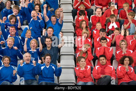 Rival fans at football match Stock Photo