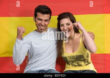 Couple smiling with Spanish flag Stock Photo
