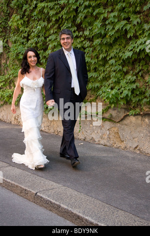 Happy spouses walking in the city Stock Photo