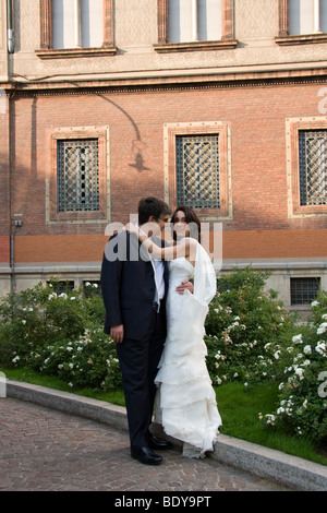 Smiling newlyweds in urban environment Stock Photo