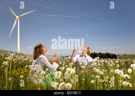 man and woman at wind turbine Stock Photo