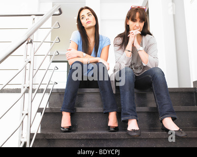 women on stairs Stock Photo