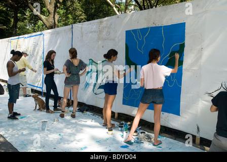 Artists work on their canvases at the Howl! Festival's 'Art Around the Park' around Tompkins Square Park in New York Stock Photo