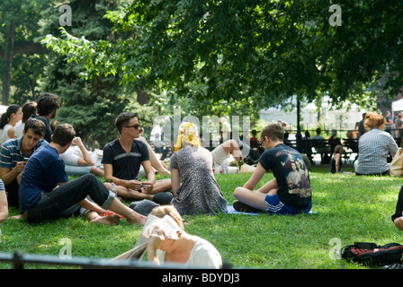 Hipsters hang out in Tompkins Square Park in the East Village neighborhood of New York Stock Photo