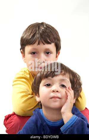 Six-year-old boy with his three-year-old sister Stock Photo