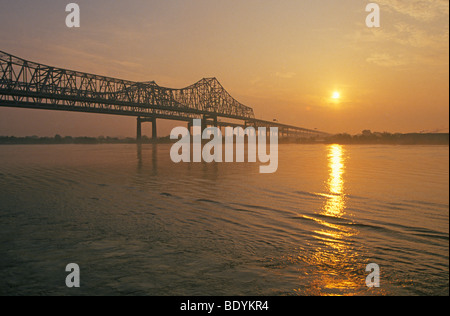 The Mississippi River and a bridge in downtown New Orleans Louisiana at dawn. Stock Photo