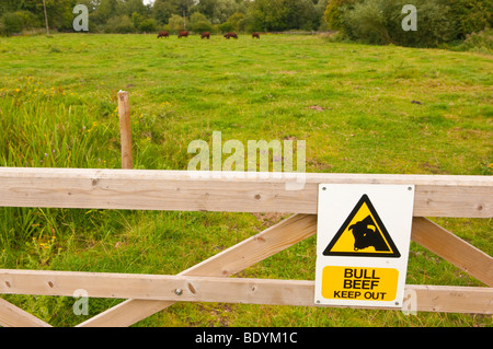 A sign warning of a bull in a field at Gressenhall museum of rural life in North Norfolk Uk Stock Photo