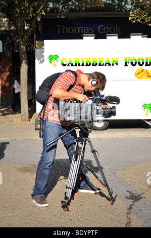 TV camera man filming in Luton Stock Photo