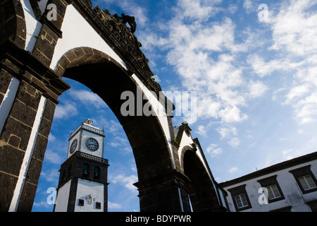 Clock tower of Sao Sebastiao church and old city gates in Ponta Delgada Azores, Portugal, Europe Stock Photo