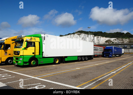 Trucks waiting at the loading dock for the car ferry Dover-Calais in front of the White Cliffs of Dover, Dover, England, Europe Stock Photo