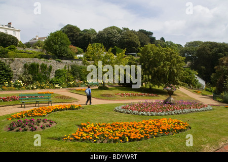 dh Candie Park Lower Gardens ST PETER PORT GUERNSEY Tourist walking through Candie Park Lower Gardens Stock Photo