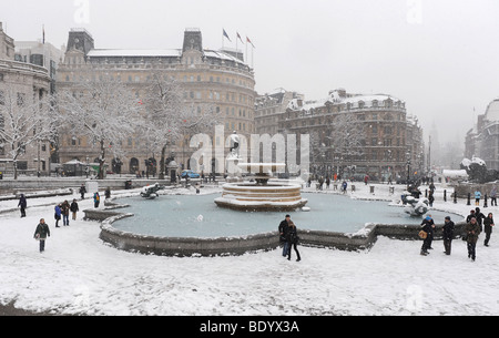 People at Trafalgar Square, London, in the snow. Stock Photo