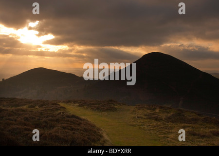 View from the top of the eastern peak of the Eildon Hills looking towards the other two peaks - Scottish Borders - midwinter Stock Photo