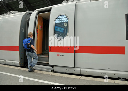 Boy, 9, boarding an ICE train, main railway station in Cologne, North Rhine-Westphalia, Germany, Europe Stock Photo