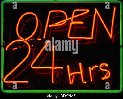 Open 24 hours shops neon sign lit up Stock Photo