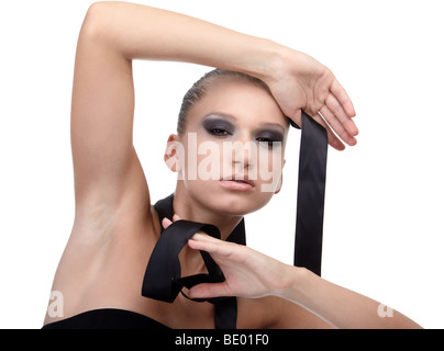 portrait of beautiful dark haired model posing with black cloth riband Stock Photo