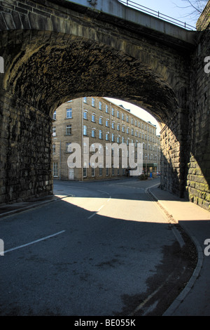 Railway arch with chocolate factory in background Stock Photo