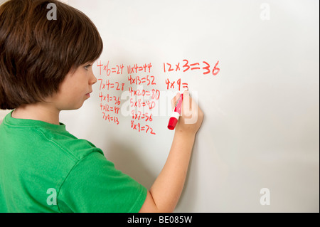 Student working on math problem Stock Photo