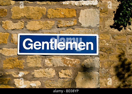 a gentlemen public toilet sign at an entrance to urinals Stock Photo