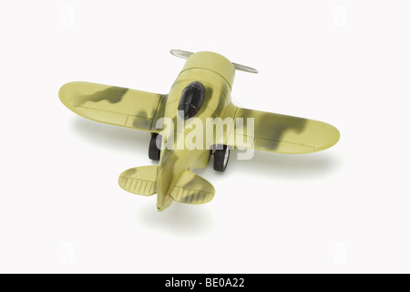 Toy military aircraft with camouflage paint on white background Stock Photo