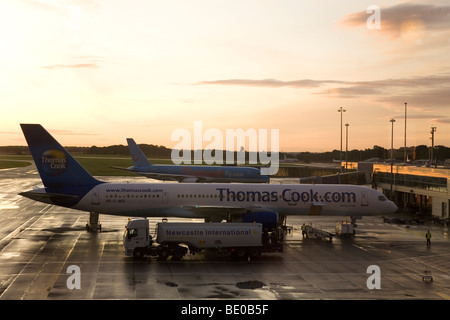 A Thomas Cook airliner stands on the tarmac of Newcastle International Airport in England. Stock Photo