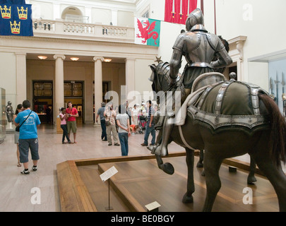 People looking at armor in the Metropolitan Museum of Art, New York City USA Stock Photo