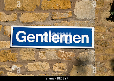 a gentlemen public toilet sign at an entrance to urinals Stock Photo