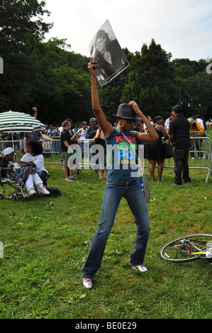 Young woman dances and enjoys Michael Jackson's birthday celebration in Brooklyn New York Stock Photo