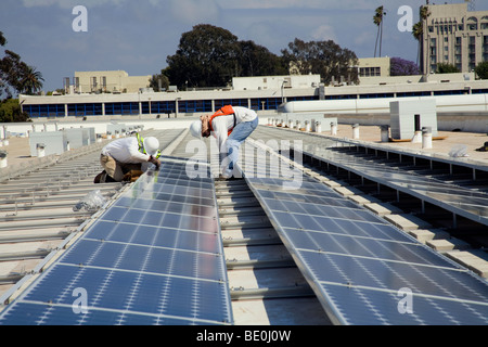 Installation of Grid-tied solar array on roof of Big Blue Bus facilities, Santa Monica, California, USA Stock Photo