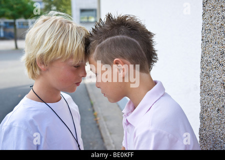 Two boys arguing in the schoolyard Stock Photo