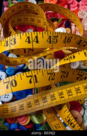 Yellow tape measure on buttons Stock Photo
