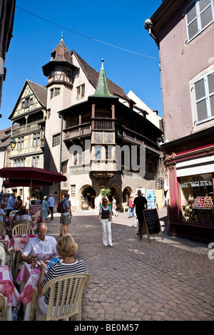 Tourists in a restaurant, Rue des Marchande, historic centre, Colmar, Alsace, France, Europe Stock Photo