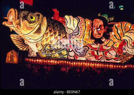 A lighted festival float is paraded through the city during the annual Aomori Nebuta Matsuri Aomori Japan Stock Photo