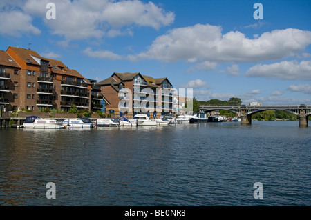 Modern Apartments and Riverside Moorings On The River Thames Hampton Wick Surrey England Stock Photo