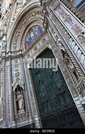 Front marble and door of the Florence Cathedral (Duomo) seen from the stairs Piazza del Duomo, Florence, Tuscany, Italy. Stock Photo